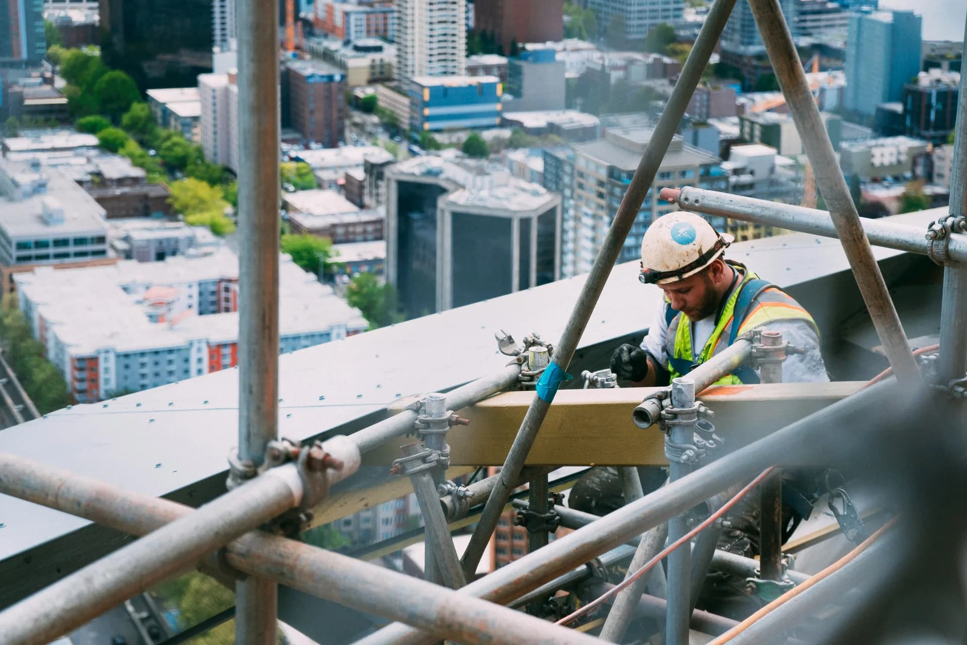 Workers and scaffolding on an active commercial construction site in Canada