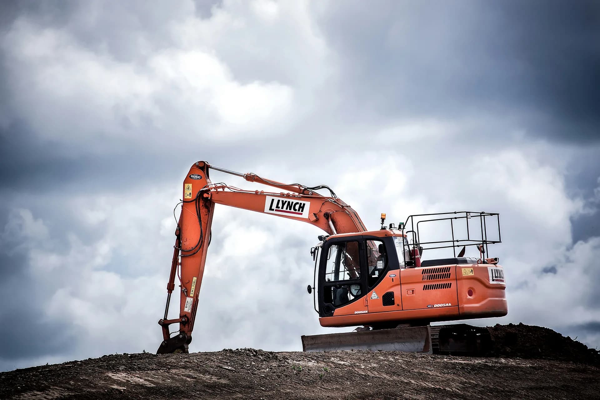 Yellow excavator digging at a Canadian civil infrastructure project